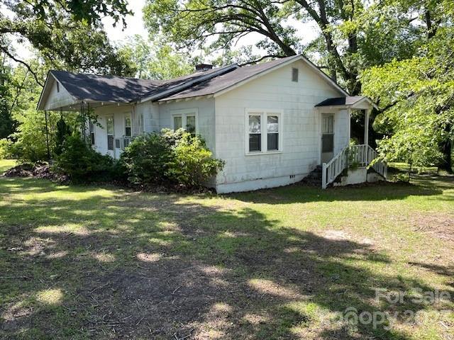 149 Robert Joyner Circle Salley, SC 29137 - Photo 45 of 48 a house that has a tree in front of it
