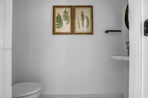 a view of room with window and wooden floor