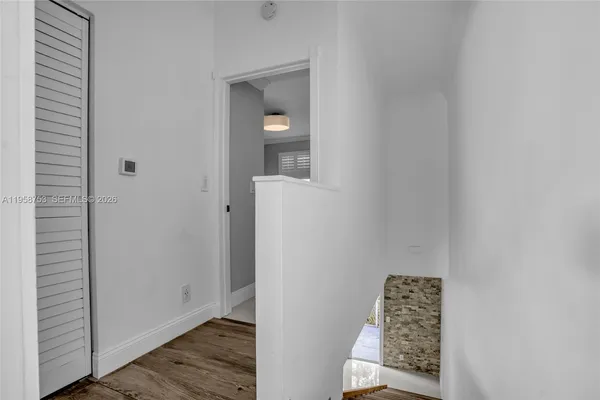 a view of entryway with wooden floor