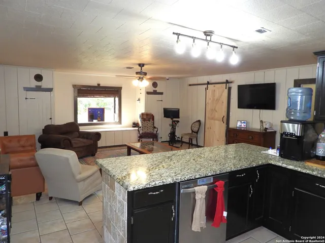 a kitchen with stainless steel appliances granite countertop a stove and a sink