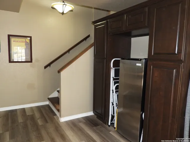 a spacious bedroom with a bed and a couch