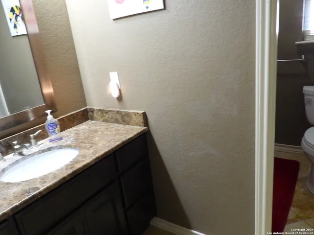 a front view of brick house with a yard