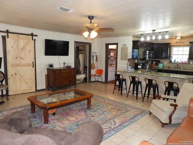 a kitchen with a table and chairs in it