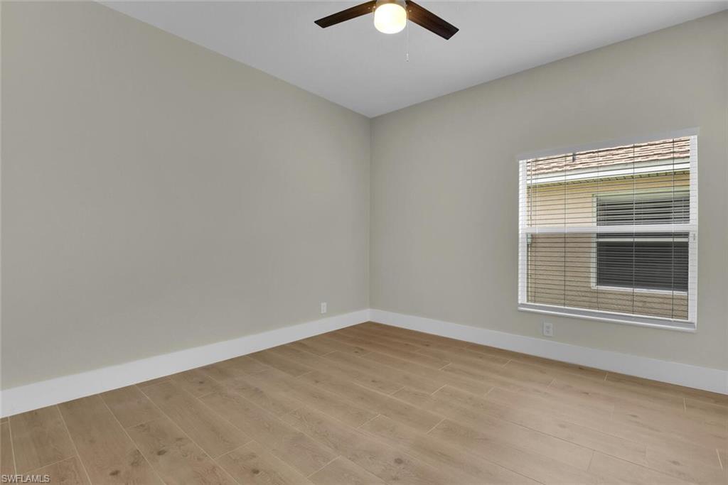 8883 Falcon Pointe Loop Fort Myers, FL 33912 - Photo 19 of 49 a view of an empty room with a window
