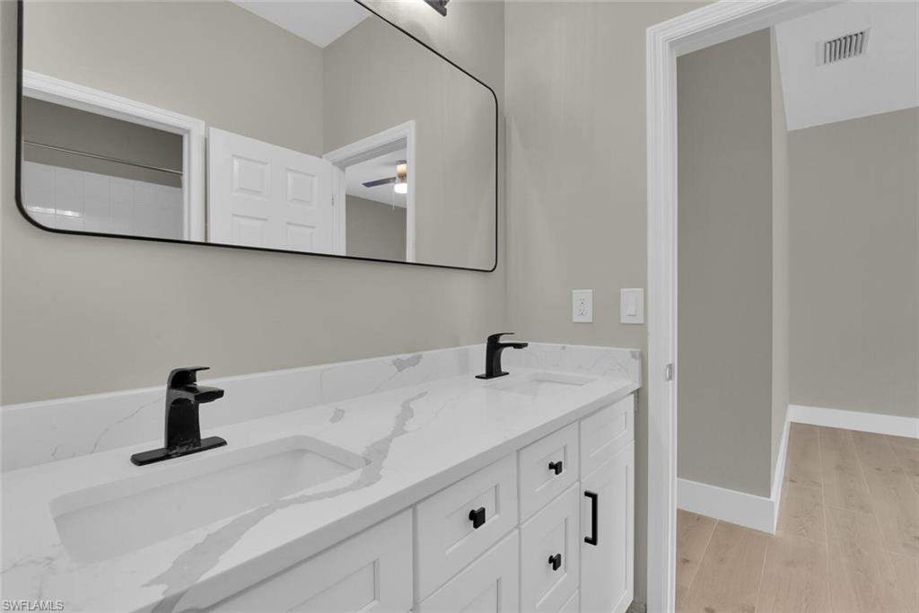 8883 Falcon Pointe Loop Fort Myers, FL 33912 - Photo 20 of 49 a bathroom with a sink and vanity
