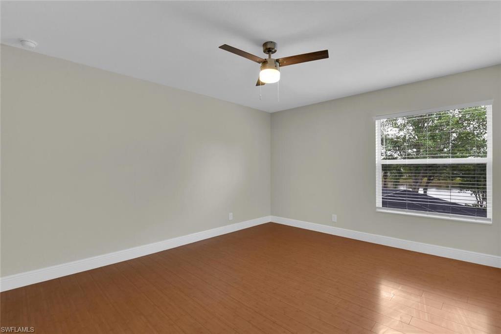8883 Falcon Pointe Loop Fort Myers, FL 33912 - Photo 21 of 49 an empty room with a window
