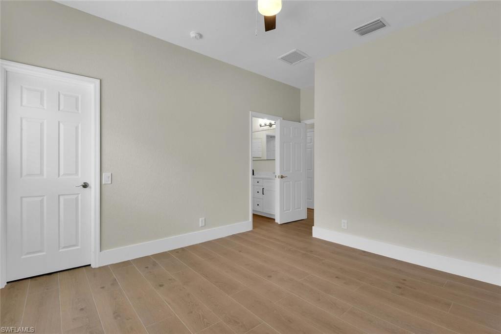 8883 Falcon Pointe Loop Fort Myers, FL 33912 - Photo 23 of 49 wooden floor in an empty room