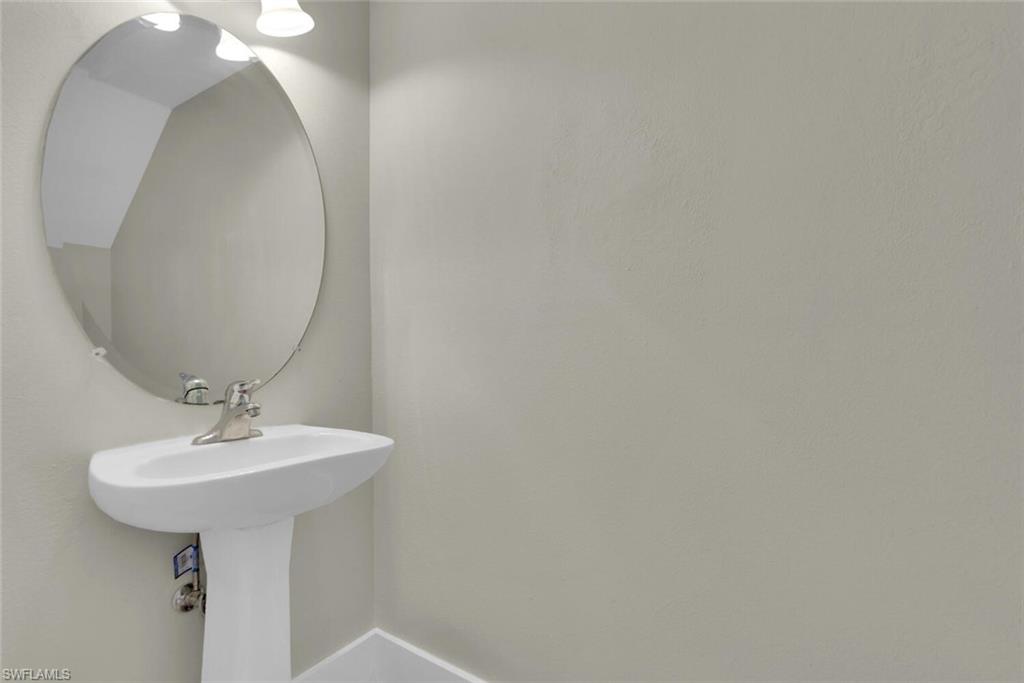 8883 Falcon Pointe Loop Fort Myers, FL 33912 - Photo 24 of 49 a bathroom with a sink and mirror