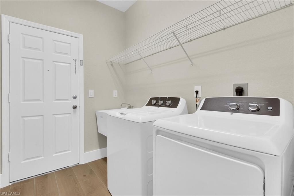 8883 Falcon Pointe Loop Fort Myers, FL 33912 - Photo 25 of 49 a utility room with dryer and washer
