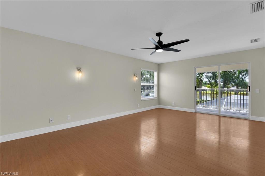 8883 Falcon Pointe Loop Fort Myers, FL 33912 - Photo 28 of 49 a view of a livingroom with a ceiling fan and window