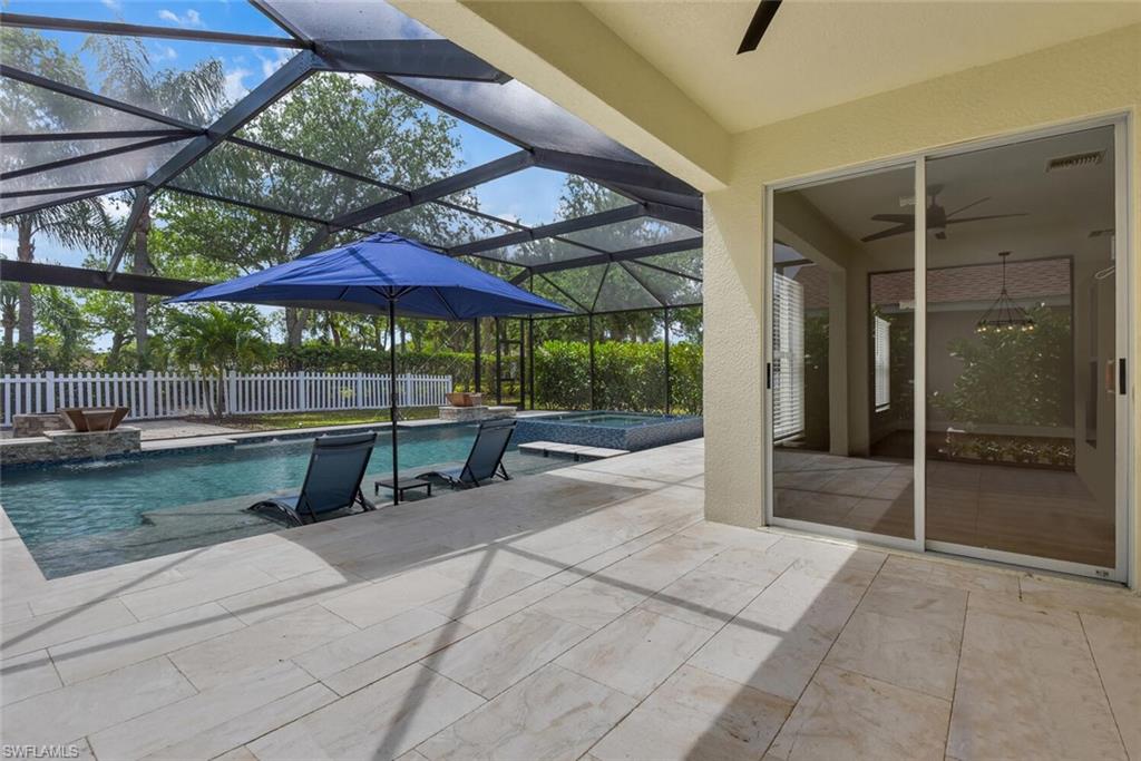 8883 Falcon Pointe Loop Fort Myers, FL 33912 - Photo 3 of 49 a view of a backyard with a wooden fence