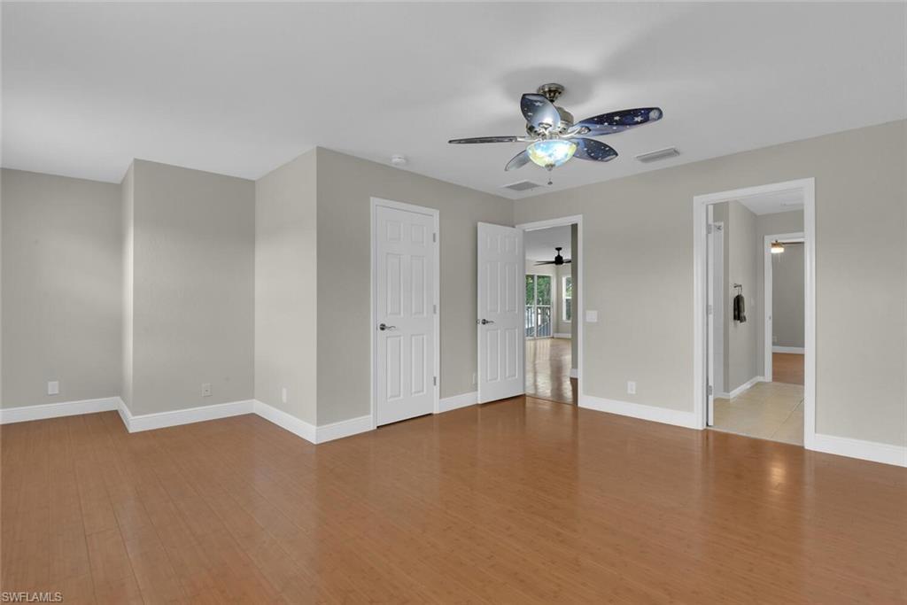 8883 Falcon Pointe Loop Fort Myers, FL 33912 - Photo 37 of 49 a view of an empty room with a ceiling fan