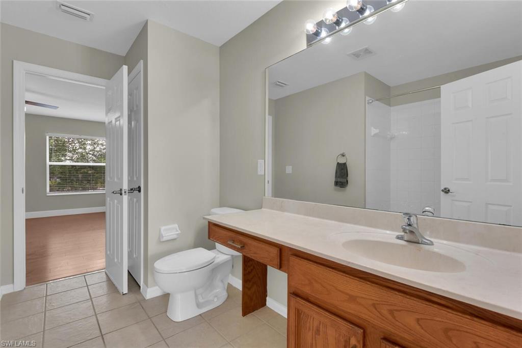 8883 Falcon Pointe Loop Fort Myers, FL 33912 - Photo 38 of 49 a bathroom with a sink a toilet and shower