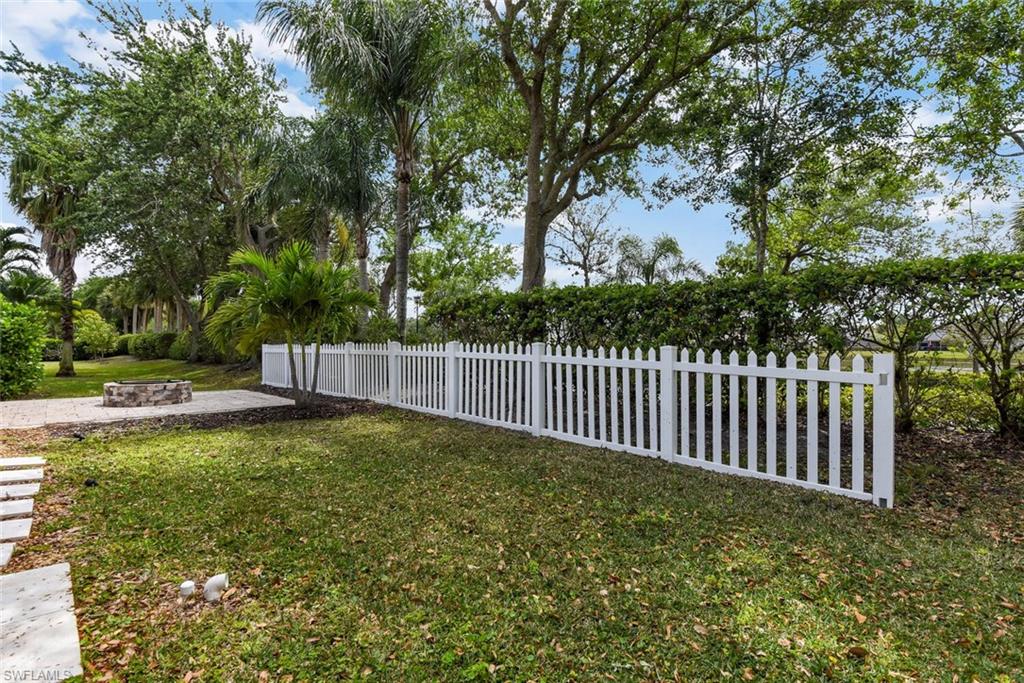 8883 Falcon Pointe Loop Fort Myers, FL 33912 - Photo 42 of 49 a view of a backyard with a small cabin