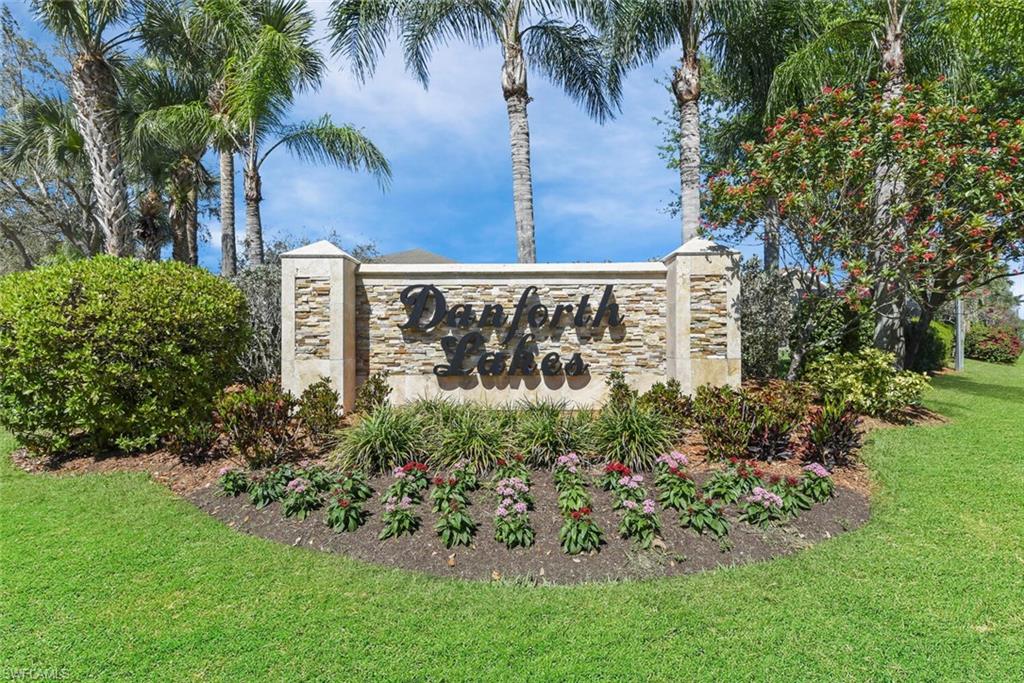 8883 Falcon Pointe Loop Fort Myers, FL 33912 - Photo 44 of 49 a view of a garden with a building