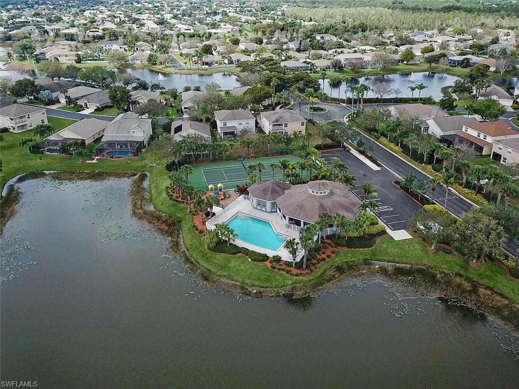 8883 Falcon Pointe Loop Fort Myers, FL 33912 - Photo 45 of 49 an aerial view of a house with a garden and lake view