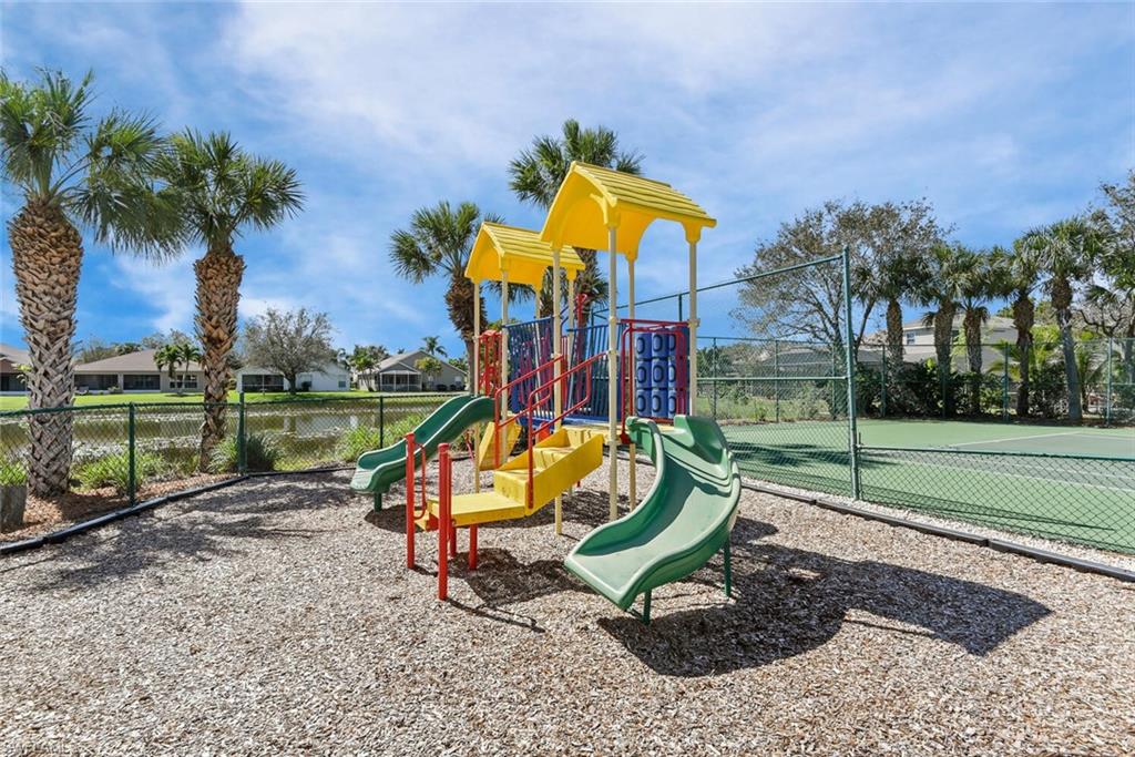 8883 Falcon Pointe Loop Fort Myers, FL 33912 - Photo 47 of 49 a view of a park with swings and slides