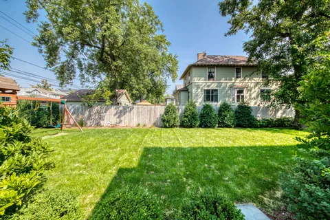 a view of a house with a yard and plants