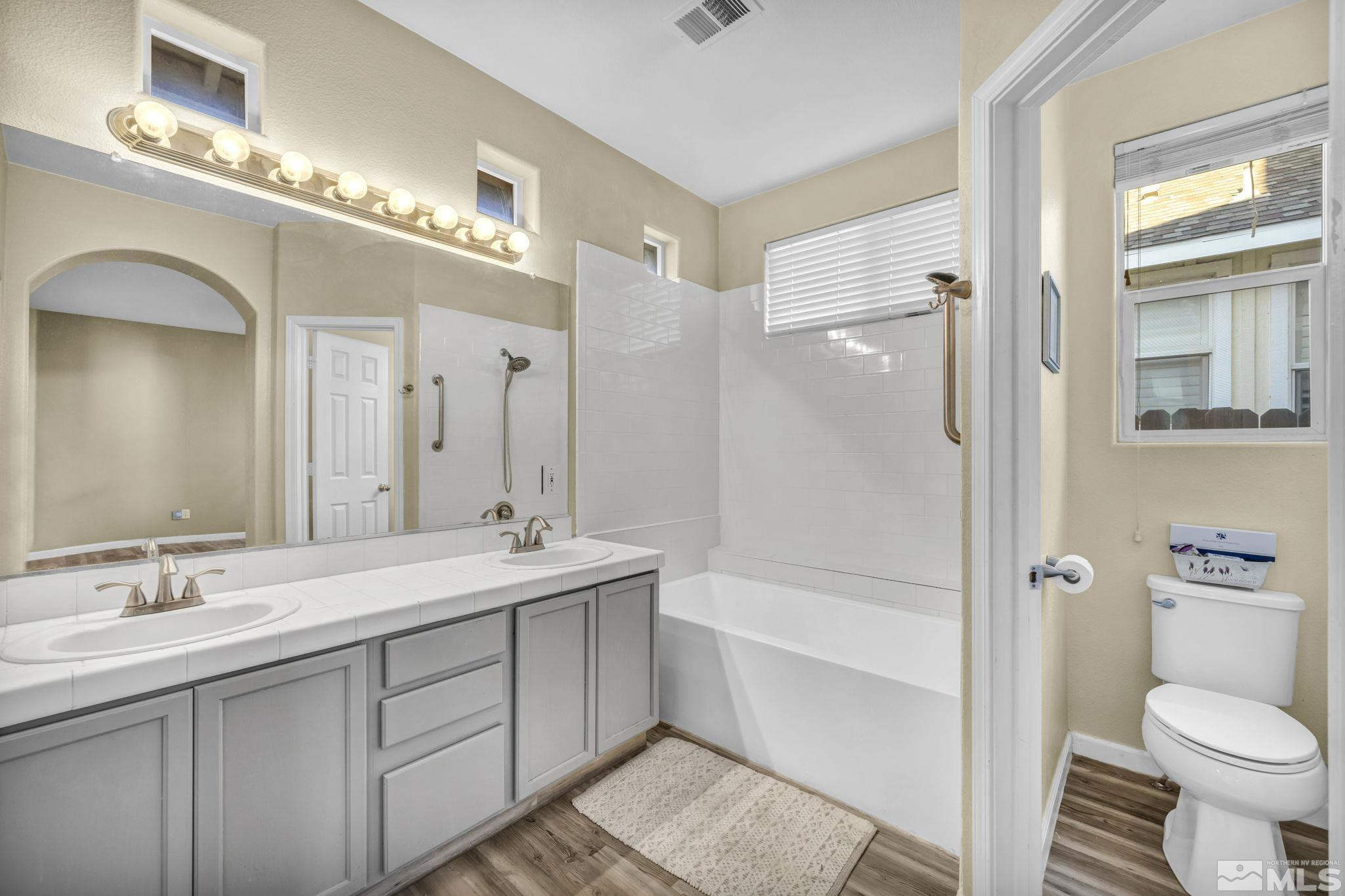 3713 Heron's Landing Drive Reno, NV 89502 - Photo 17 of 35 a bathroom with a sink a toilet and shower