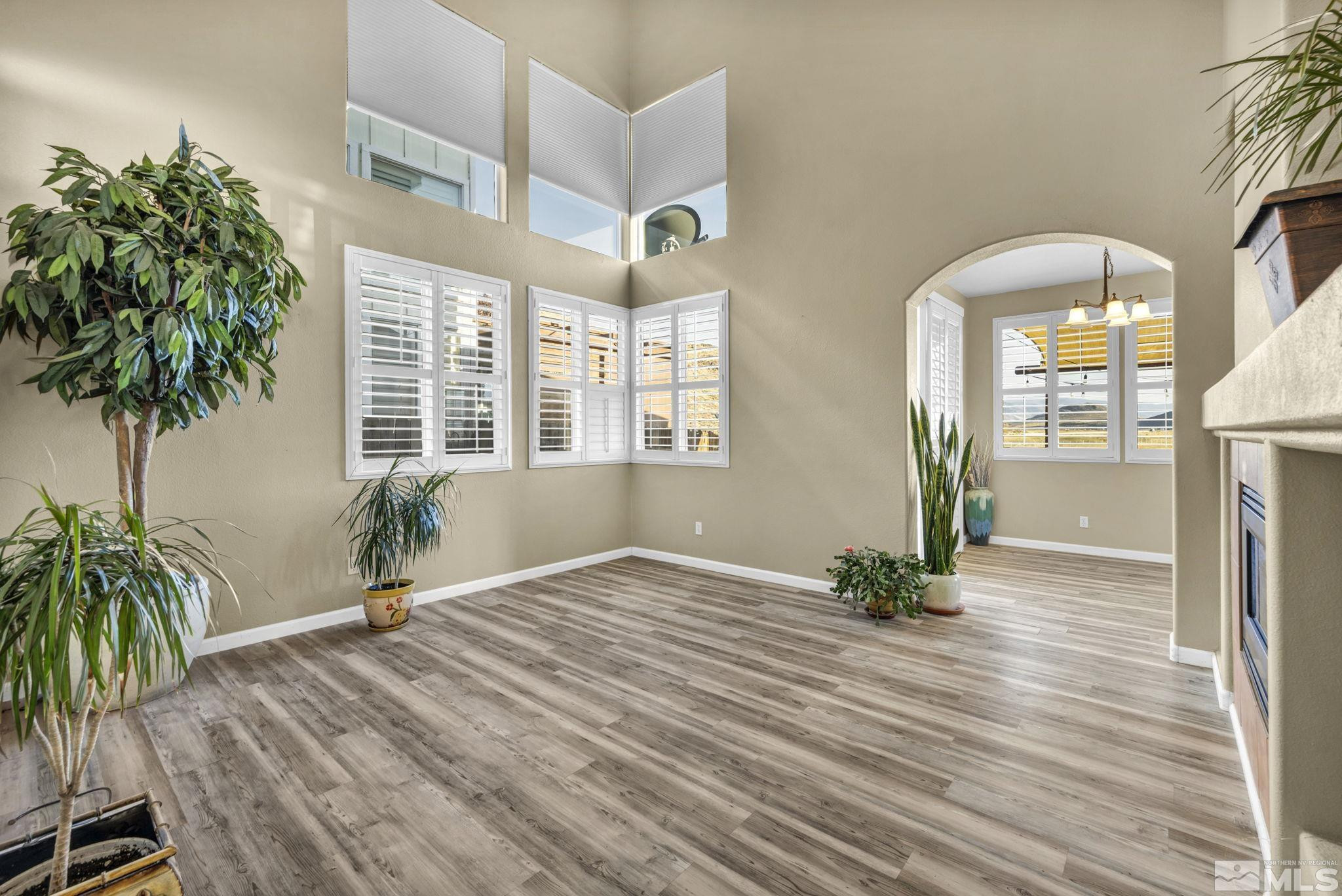 3713 Heron's Landing Drive Reno, NV 89502 - Photo 8 of 35 a view of a room with potted plants and wooden floor