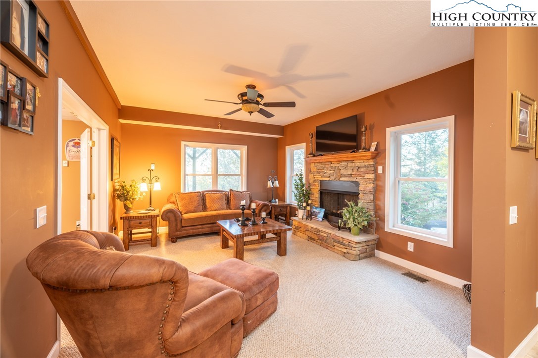 309 Pinnacle Ridge Road Beech Mountain, NC 28604 - Photo 25 of 45 a living room with furniture large window and flat screen tv