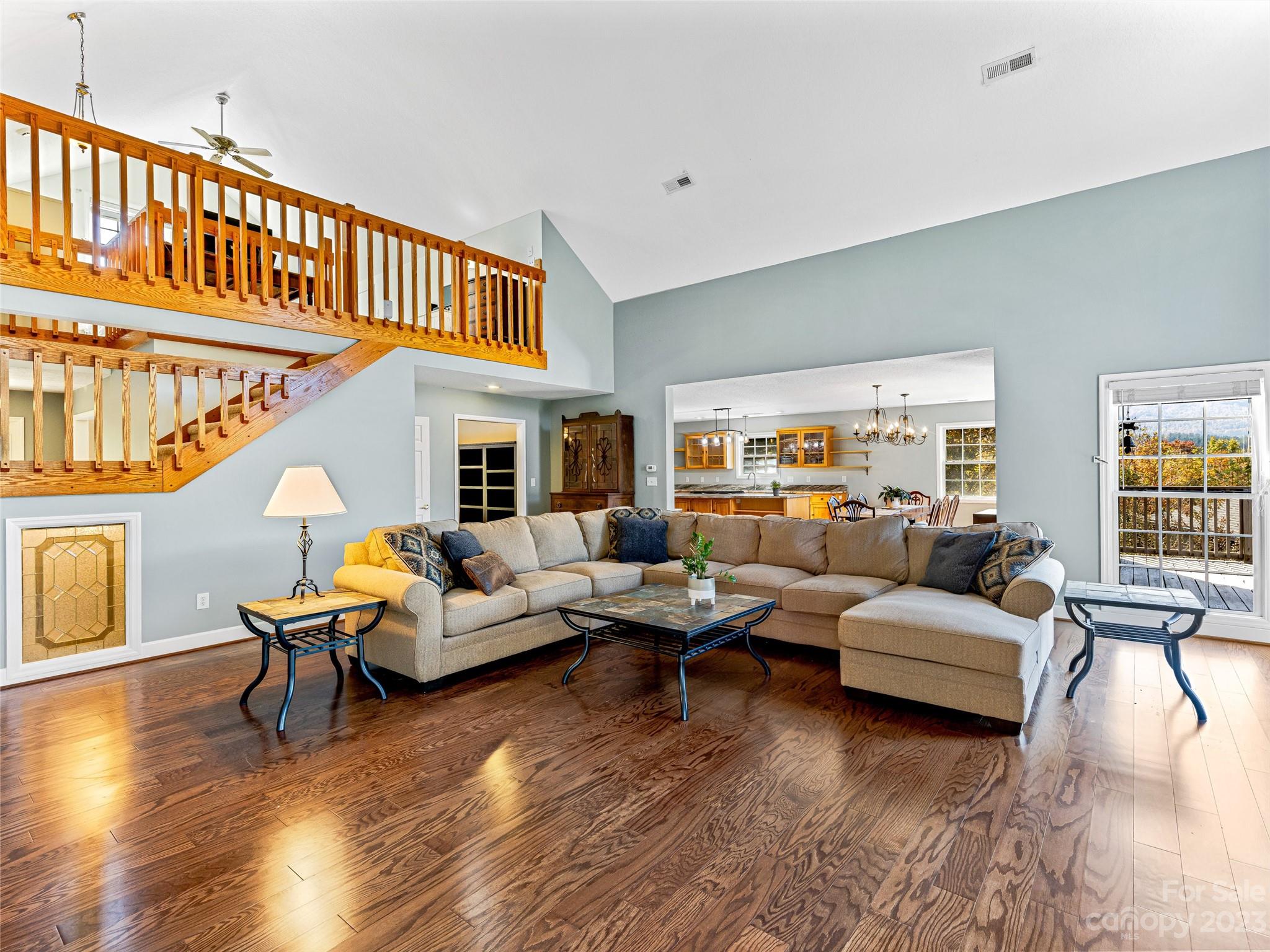263 Sylvan Lane Mill Spring, NC 28756 - Photo 12 of 45 a living room with furniture or couch and a wooden floor