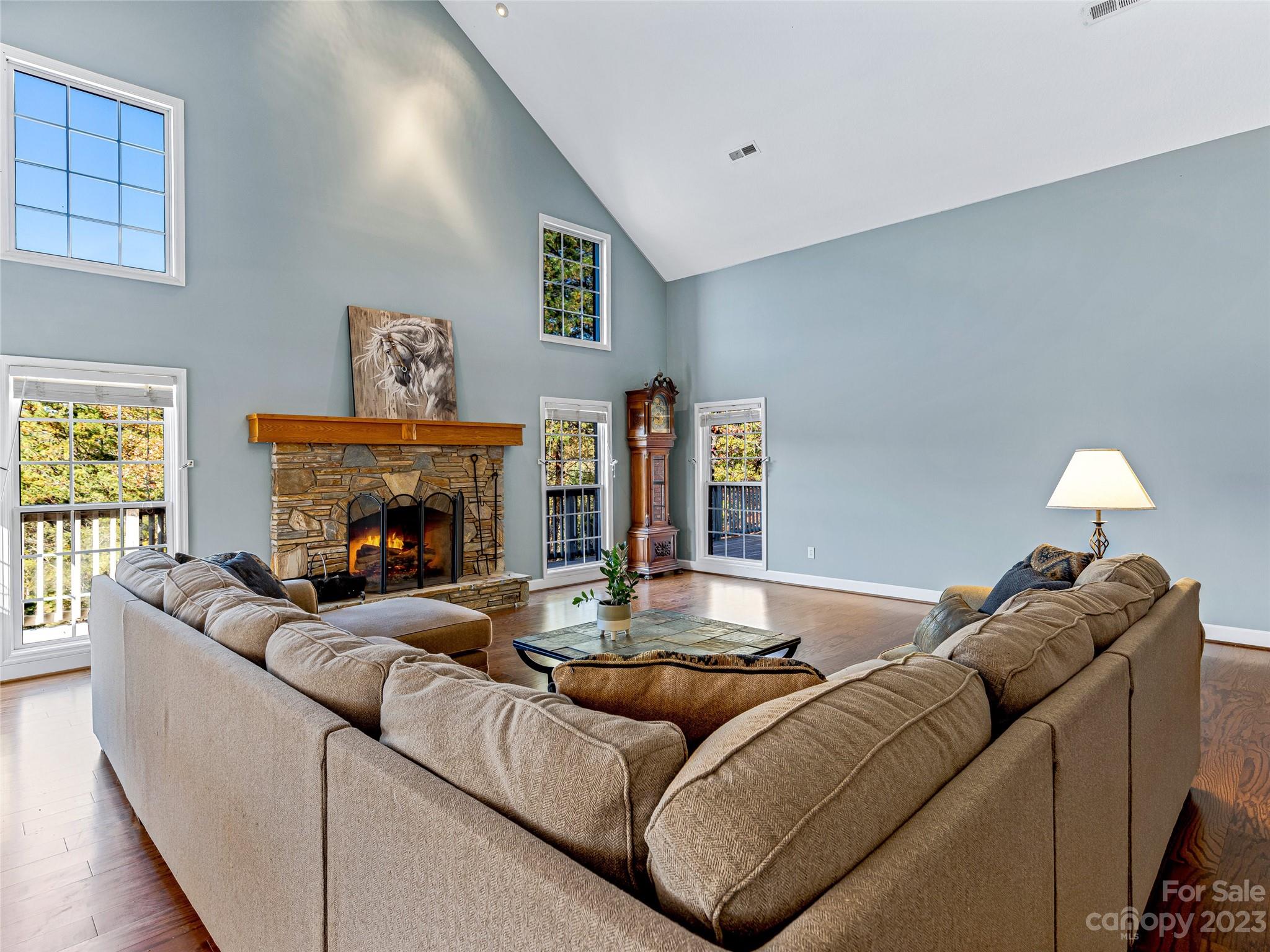 263 Sylvan Lane Mill Spring, NC 28756 - Photo 14 of 45 a living room with furniture and a fireplace