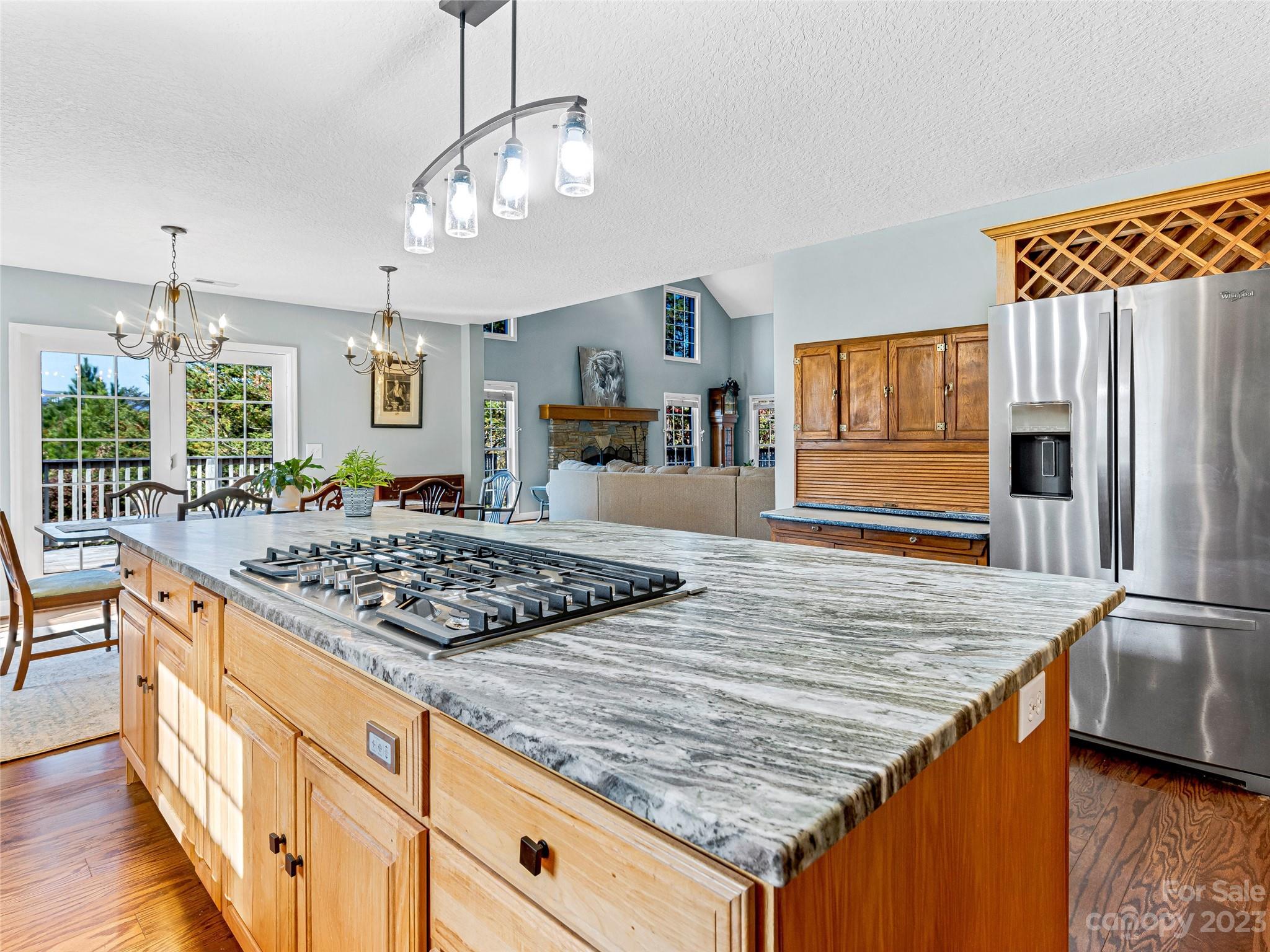 263 Sylvan Lane Mill Spring, NC 28756 - Photo 17 of 45 a kitchen with stainless steel appliances granite countertop a sink stove and refrigerator