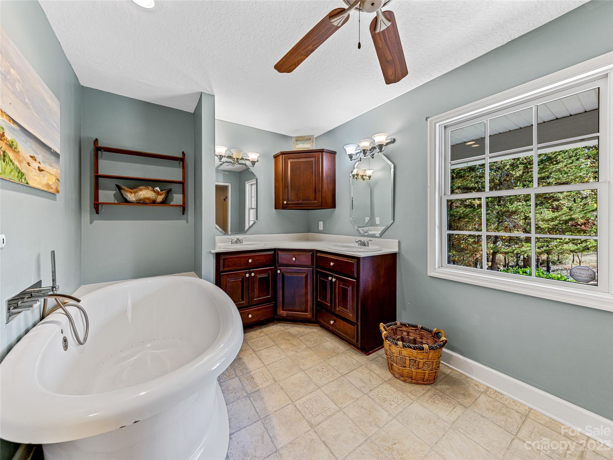 263 Sylvan Lane Mill Spring, NC 28756 - Photo 20 of 45 a bathroom with a sink and a mirror