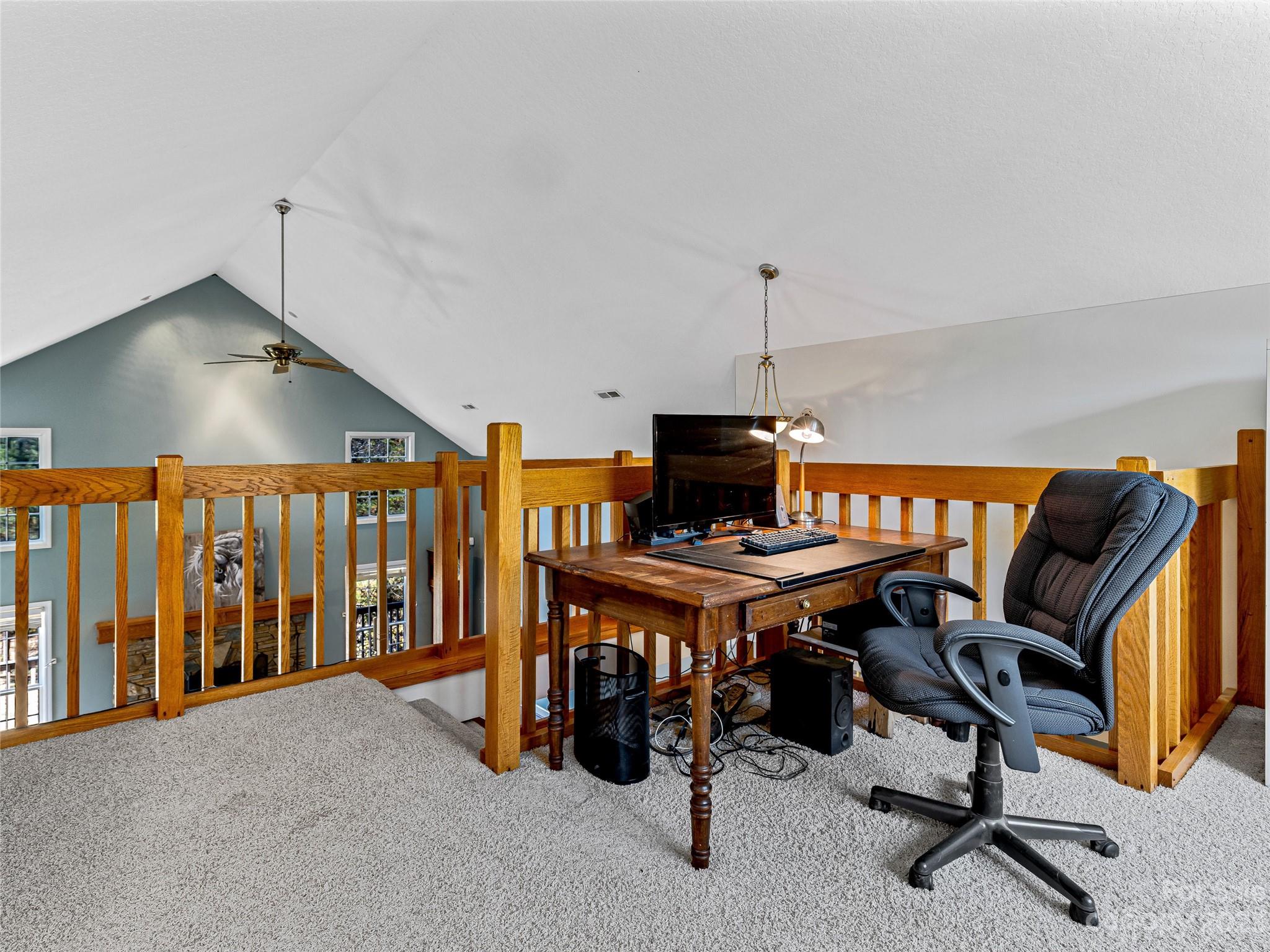 263 Sylvan Lane Mill Spring, NC 28756 - Photo 22 of 45 a view of a workspace with furniture and a window
