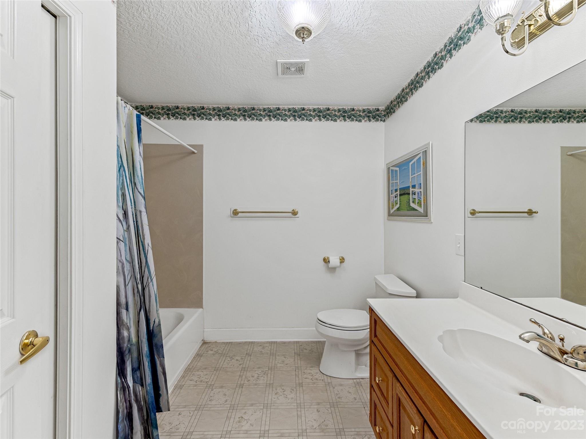 263 Sylvan Lane Mill Spring, NC 28756 - Photo 25 of 45 a bathroom with a sink and a mirror