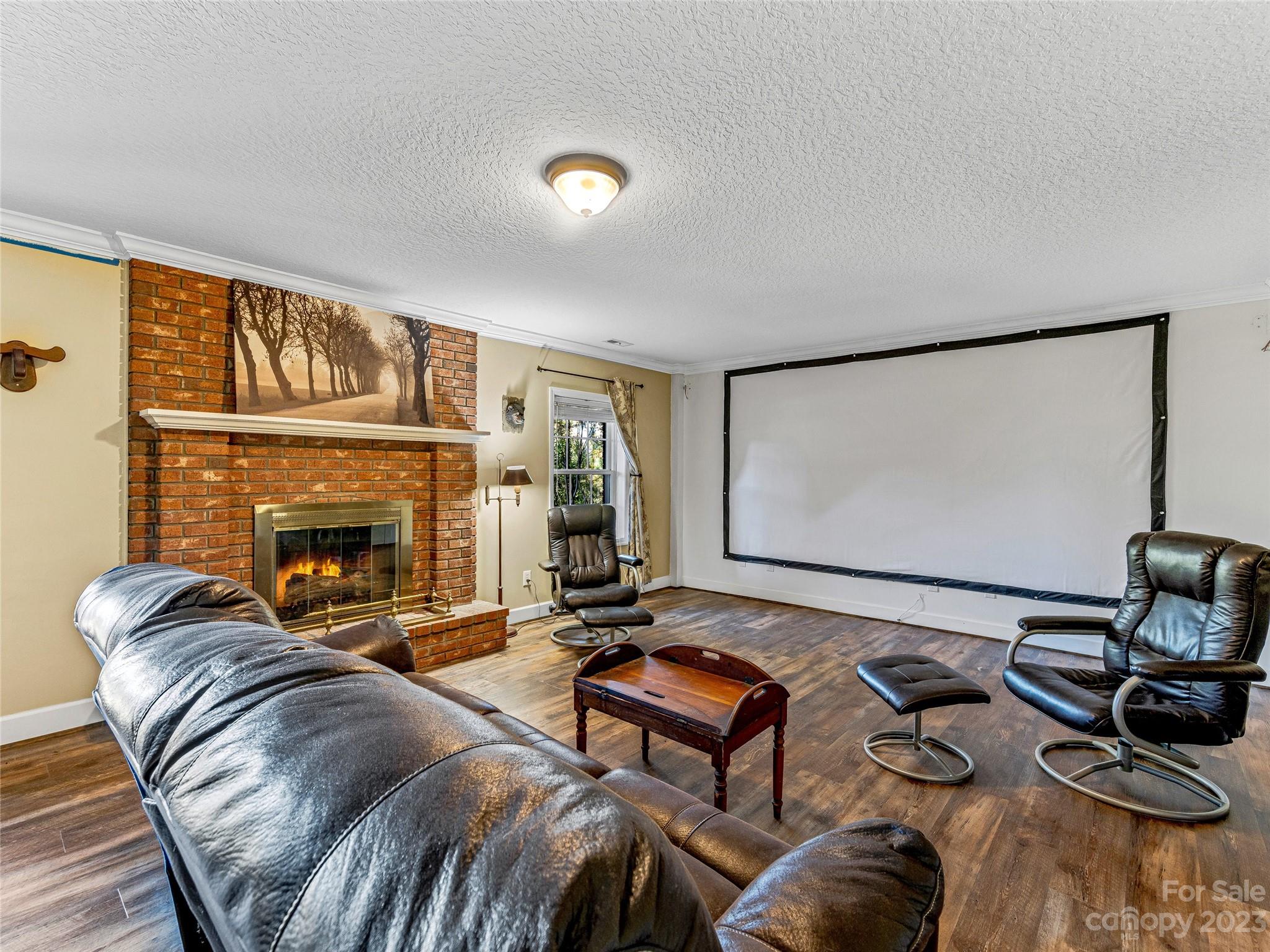 263 Sylvan Lane Mill Spring, NC 28756 - Photo 28 of 45 a living room with furniture and a fireplace