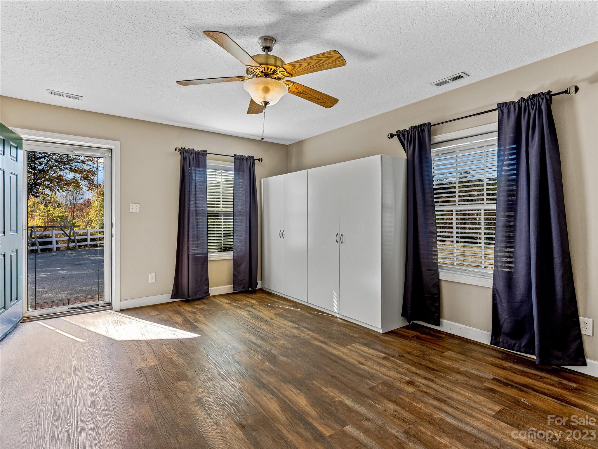 263 Sylvan Lane Mill Spring, NC 28756 - Photo 29 of 45 a view of a livingroom with a ceiling fan and window