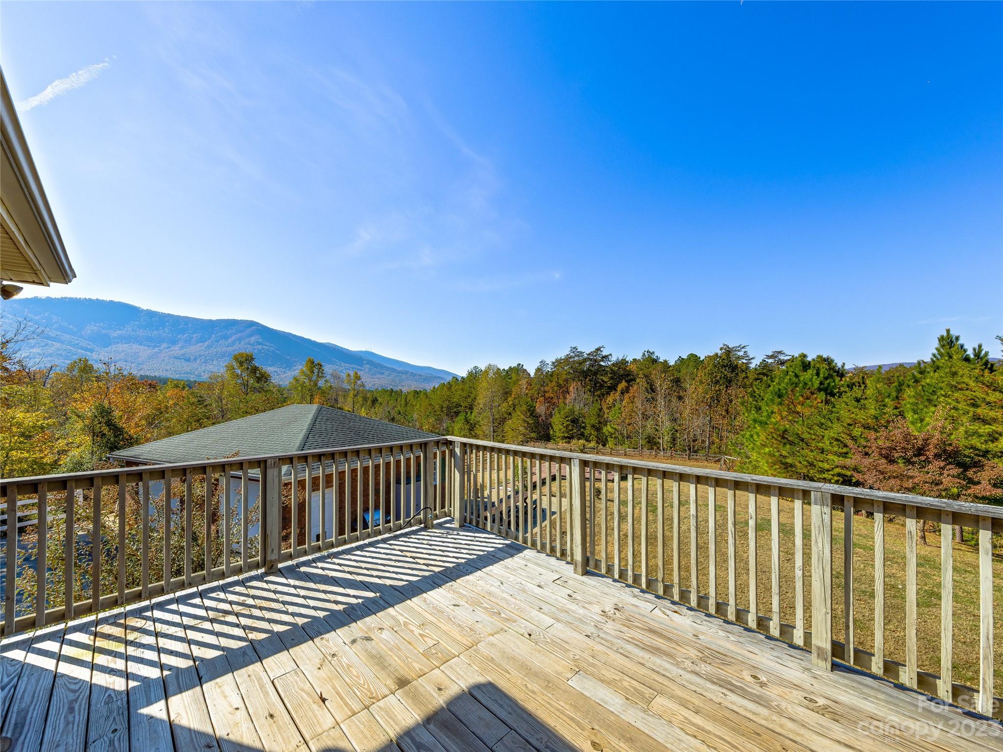 263 Sylvan Lane Mill Spring, NC 28756 - Photo 30 of 45 a view of balcony with wooden floor and city view