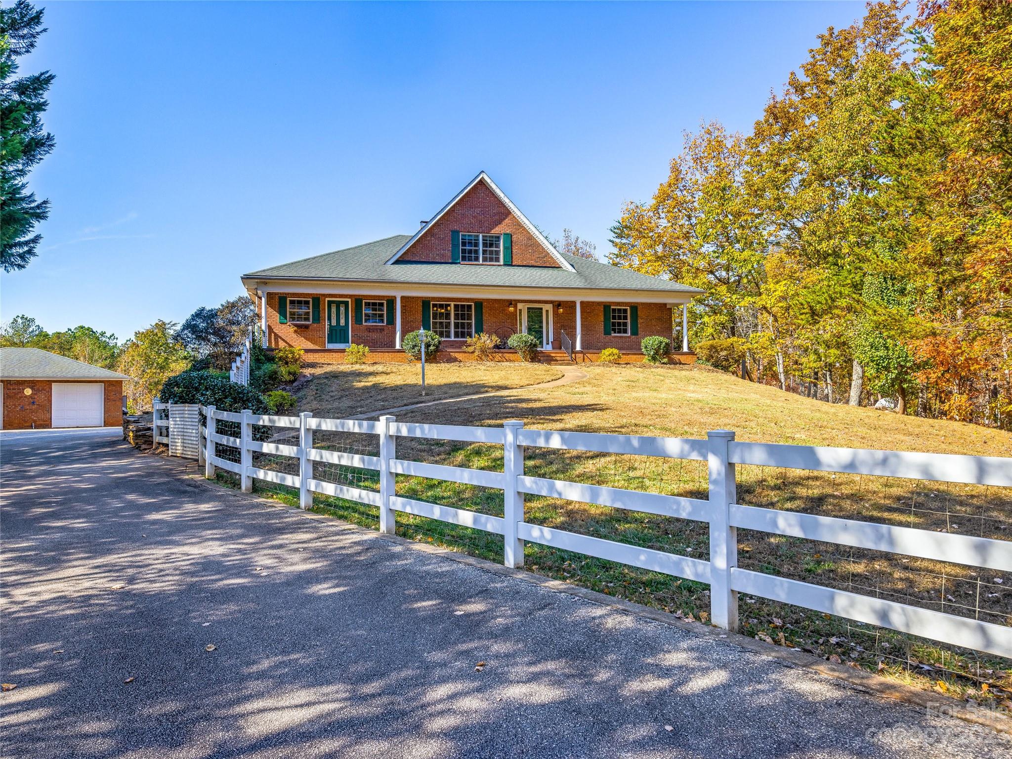 263 Sylvan Lane Mill Spring, NC 28756 - Photo 42 of 45 a front view of a house with a yard