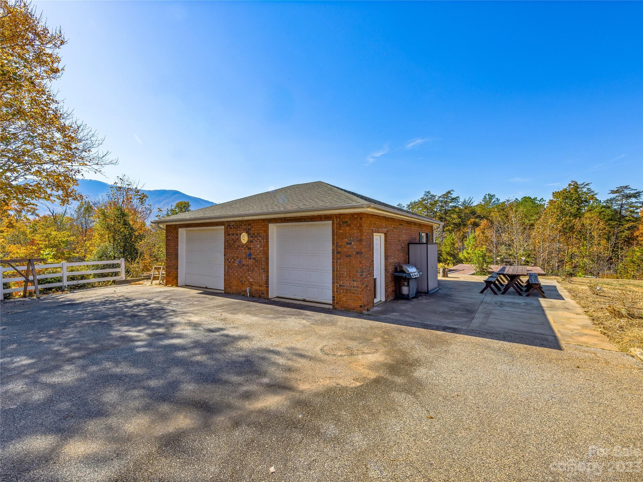263 Sylvan Lane Mill Spring, NC 28756 - Photo 43 of 45 a view of a house with backyard and trees