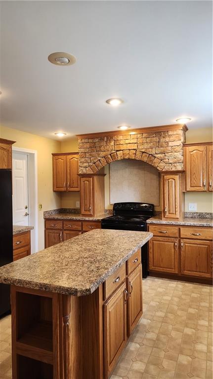 3865 Piney Dam Road Clarion, PA 16214 - Photo 27 of 41 a kitchen with stainless steel appliances granite countertop a stove a sink and a refrigerator