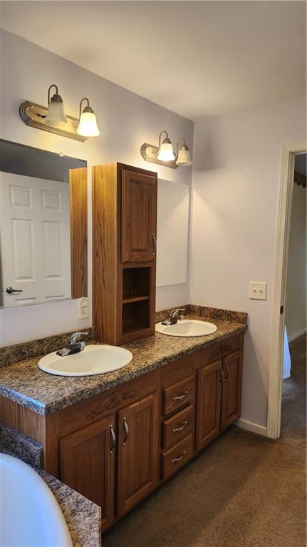 3865 Piney Dam Road Clarion, PA 16214 - Photo 34 of 41 a bathroom with a granite countertop sink and a mirror