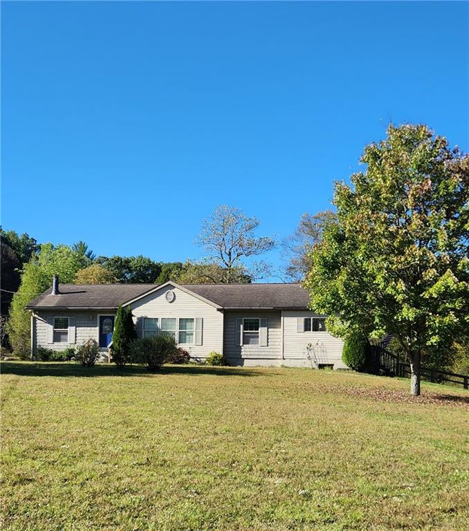 3865 Piney Dam Road Clarion, PA 16214 - Photo 9 of 41 a front view of a house with a garden