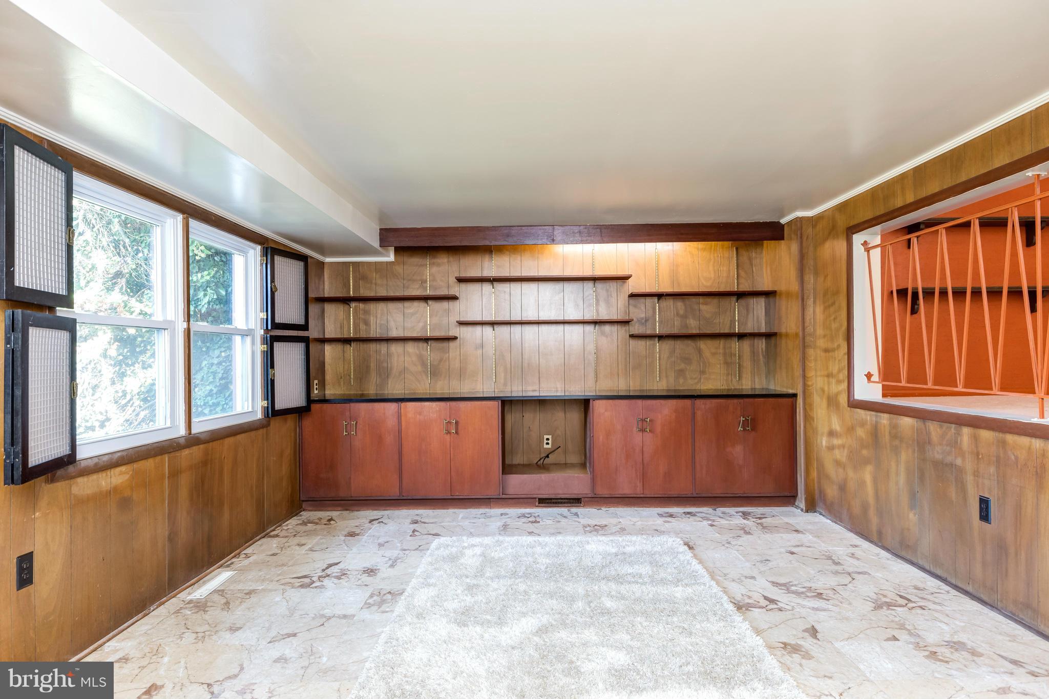 7434 Ricksway Road Pikesville, MD 21208 - Photo 11 of 30 a room with a window and wooden floor