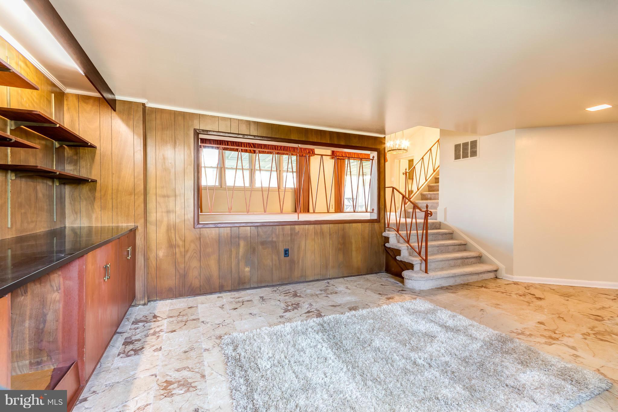 7434 Ricksway Road Pikesville, MD 21208 - Photo 12 of 30 a view of an empty room and staircase