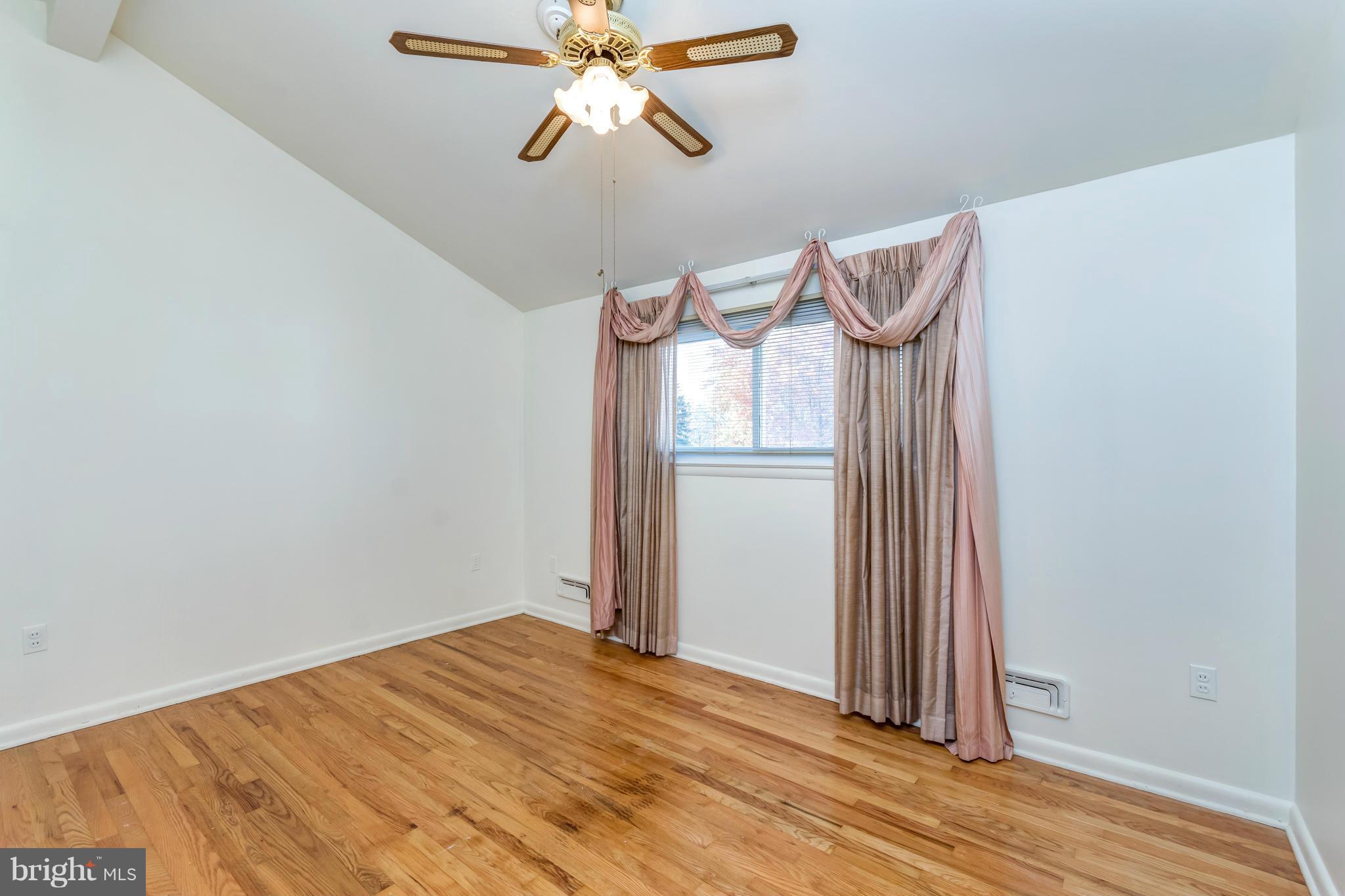 7434 Ricksway Road Pikesville, MD 21208 - Photo 19 of 30 a view of a room with wooden floor and closet