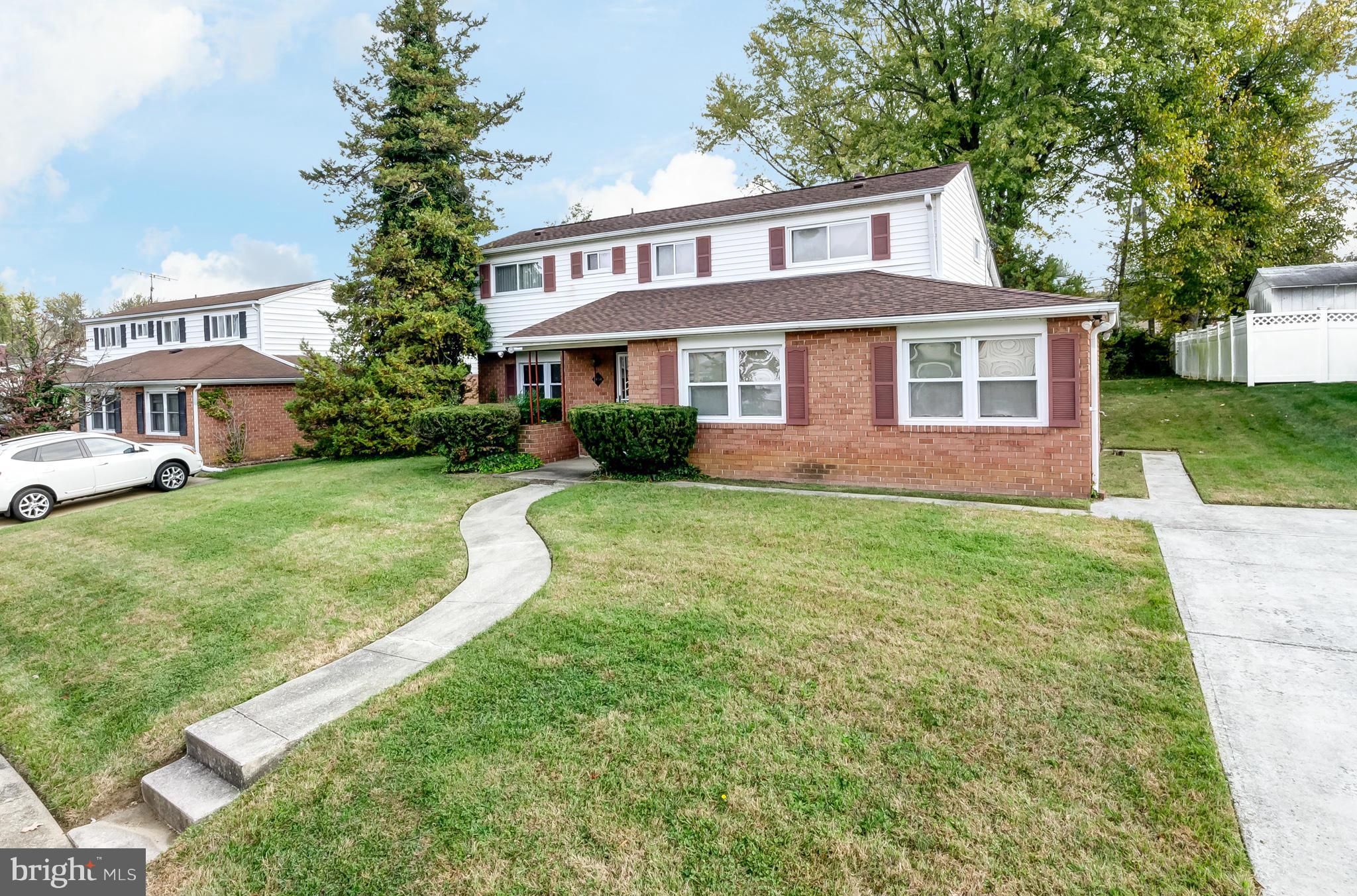 7434 Ricksway Road Pikesville, MD 21208 - Photo 3 of 30 a front view of a house with garden