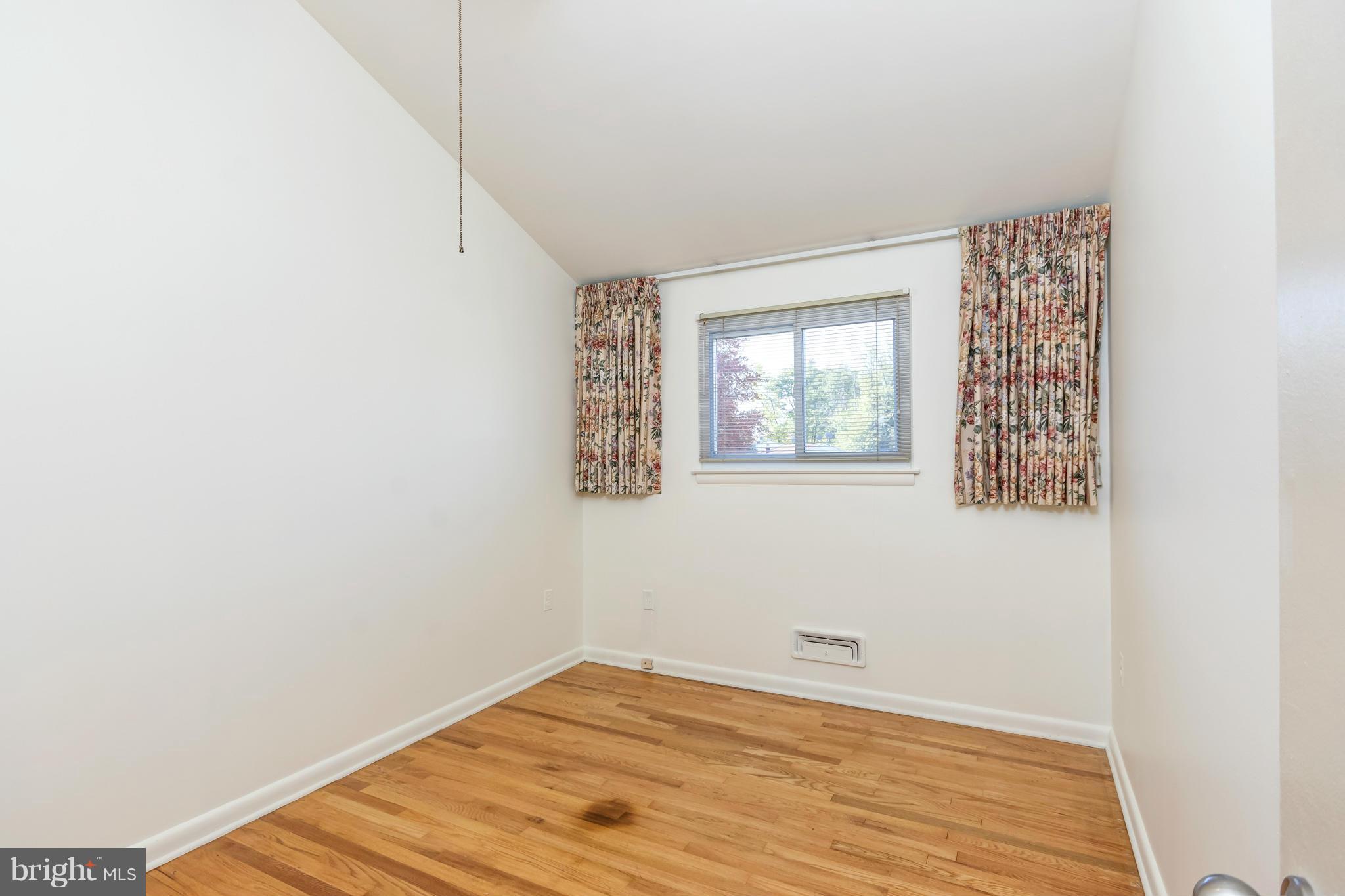 7434 Ricksway Road Pikesville, MD 21208 - Photo 21 of 30 a view of a room that has a window in it