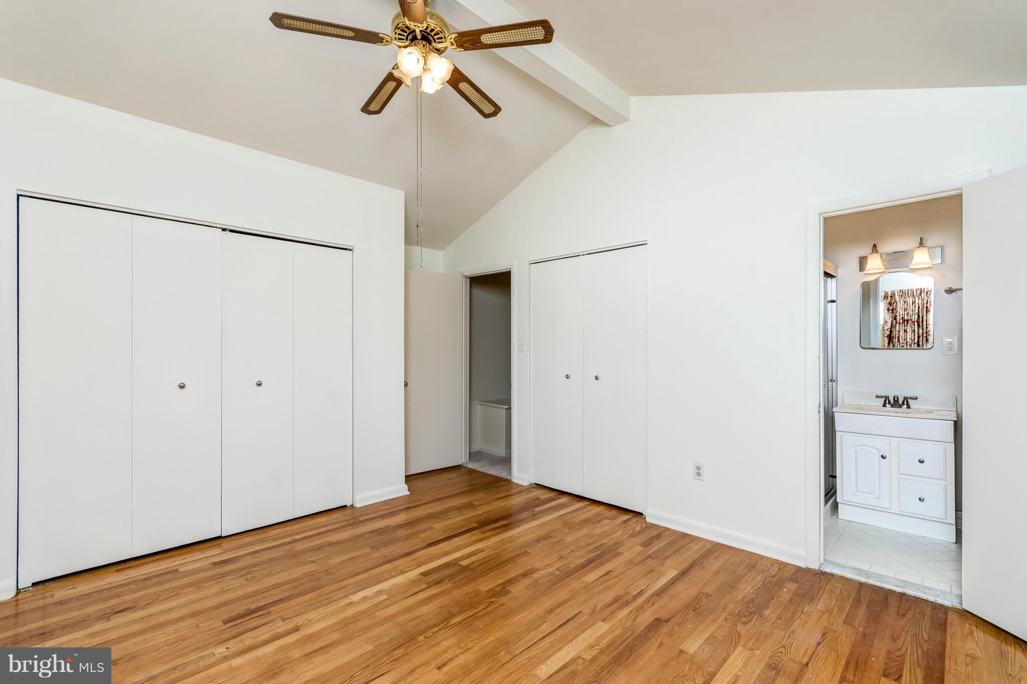 7434 Ricksway Road Pikesville, MD 21208 - Photo 24 of 30 a view of an empty room with wooden floor