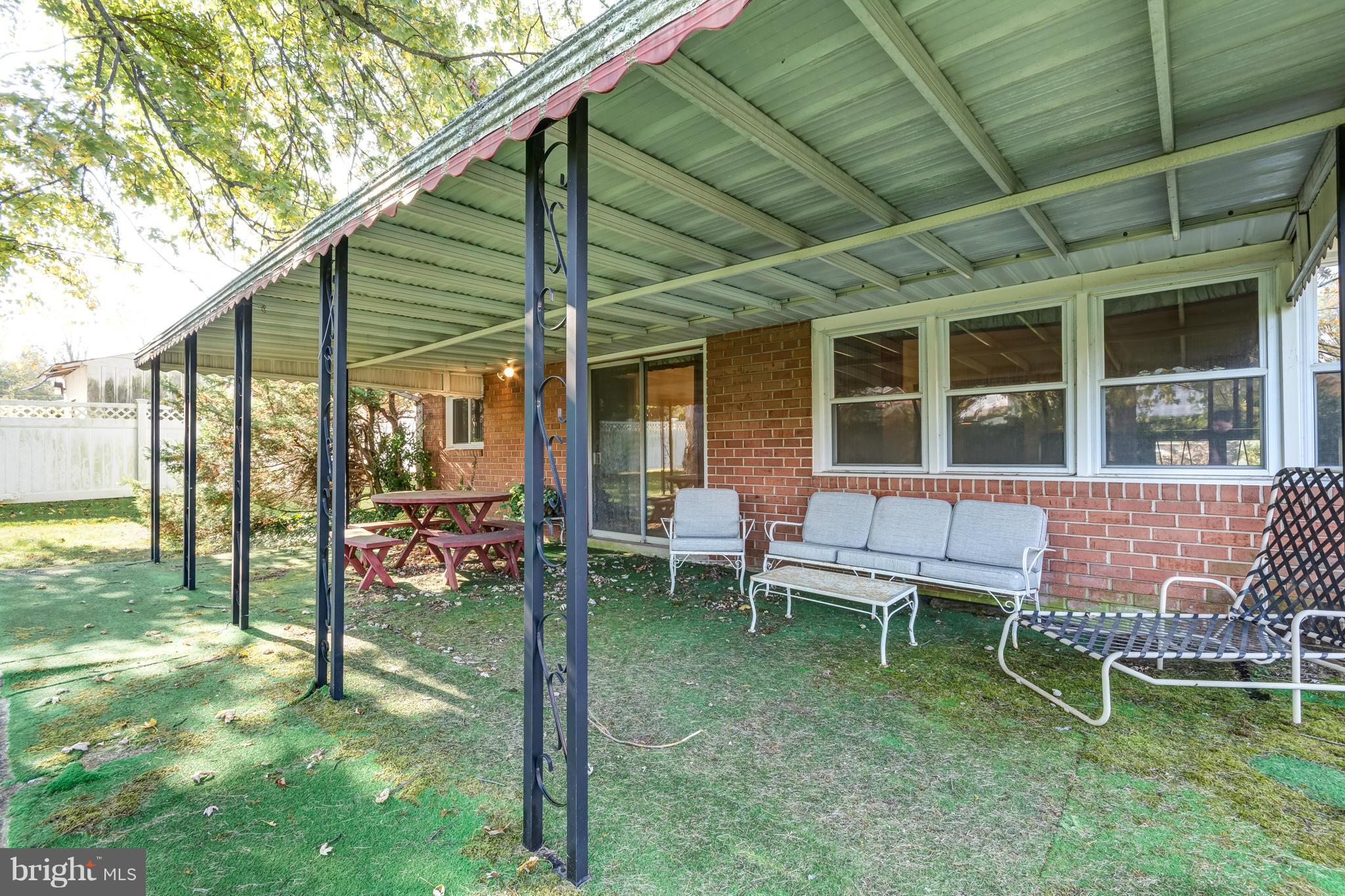 7434 Ricksway Road Pikesville, MD 21208 - Photo 26 of 30 a backyard of a house with outdoor seating