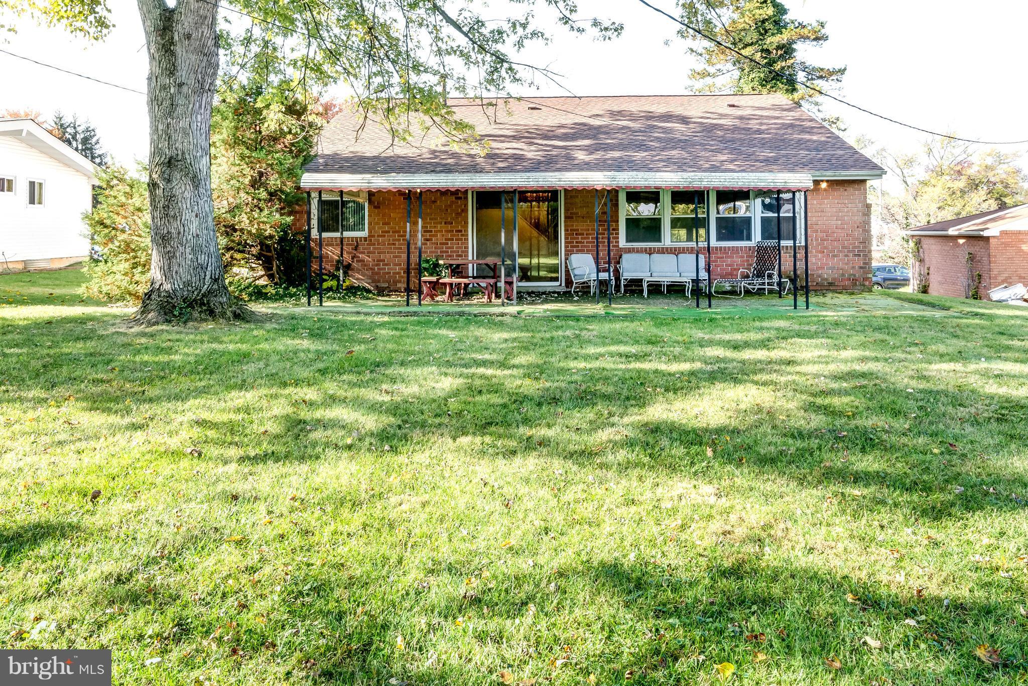 7434 Ricksway Road Pikesville, MD 21208 - Photo 29 of 30 a front view of a house with garden