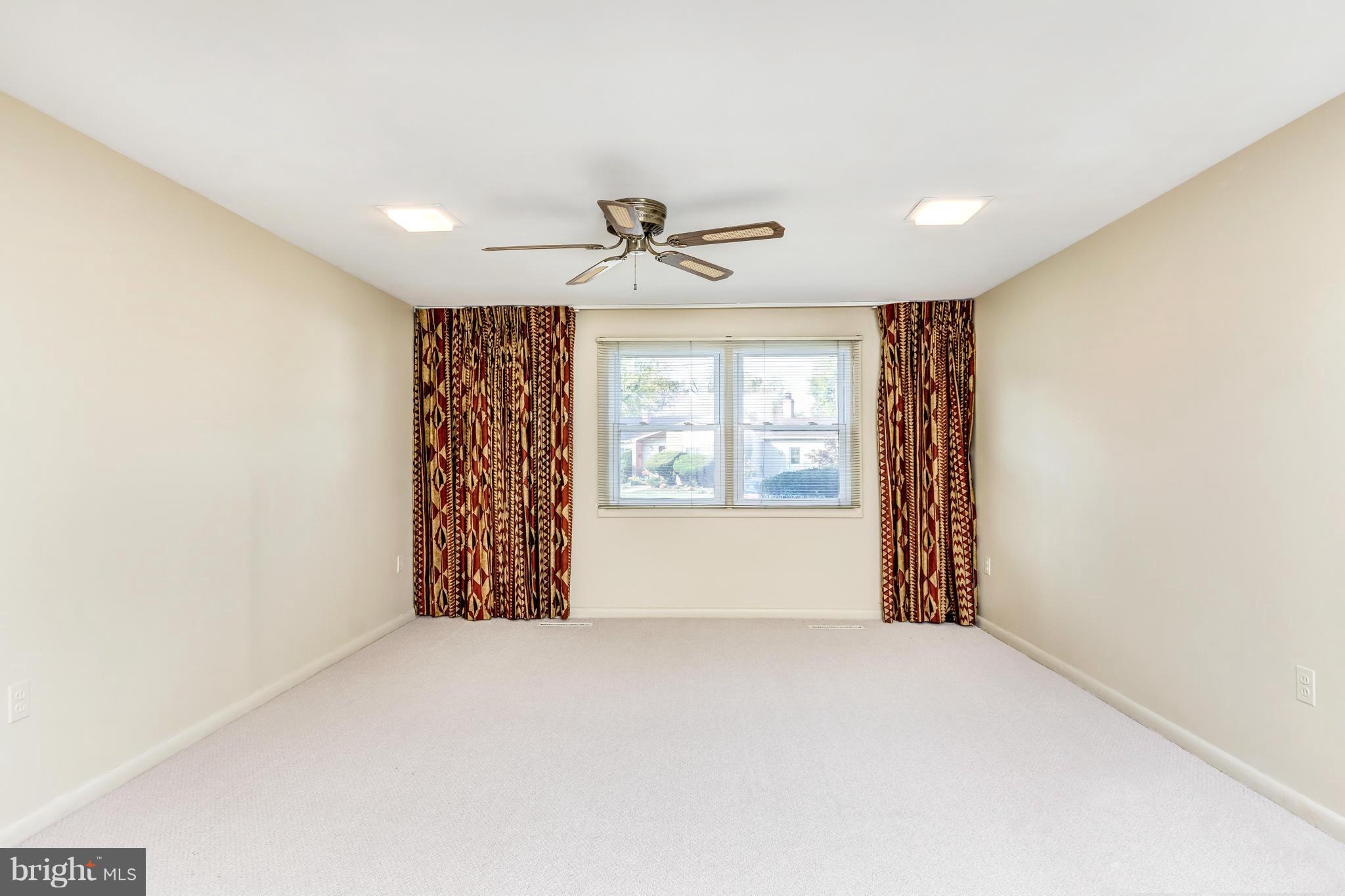 7434 Ricksway Road Pikesville, MD 21208 - Photo 8 of 30 a view of an empty room with a window