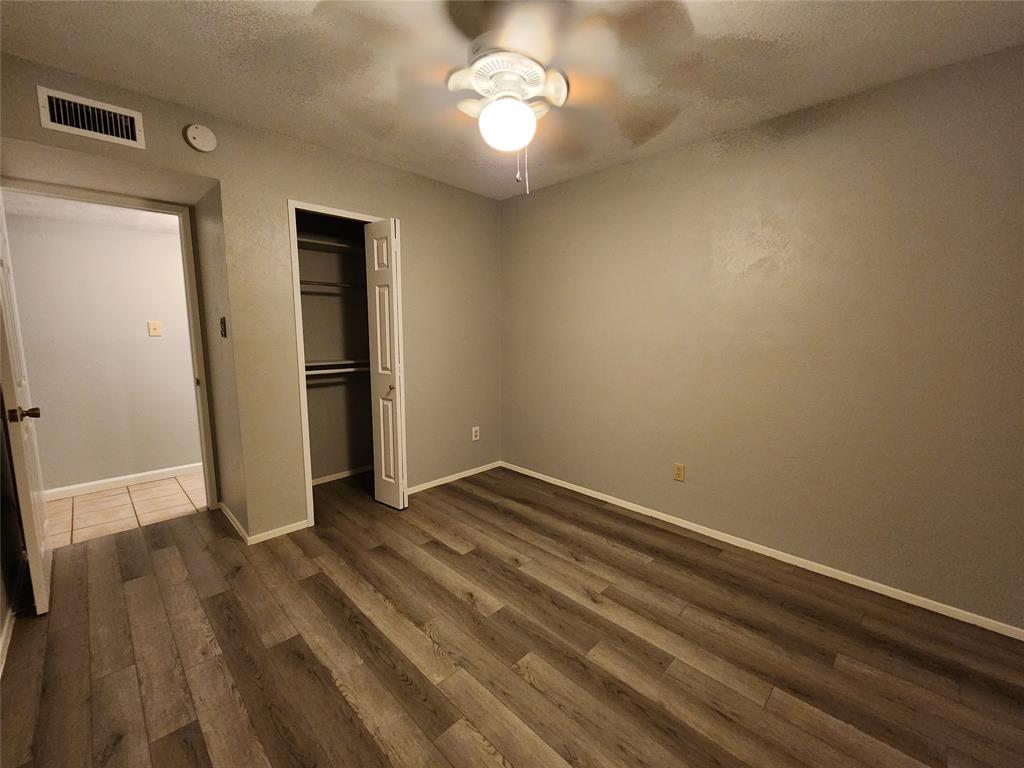 5604 Usher Street The Colony, TX 75056 - Photo 27 of 30 a view of empty room with wooden floor