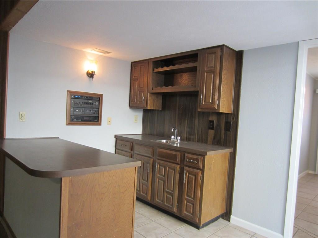 5604 Usher Street The Colony, TX 75056 - Photo 6 of 30 a kitchen with stainless steel appliances granite countertop a stove and a microwave